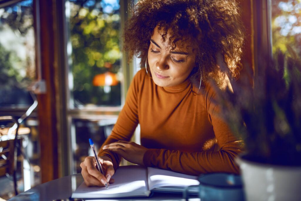 woman working on her business mission statement