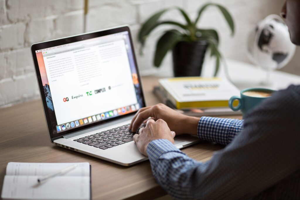 Photo of man using laptop